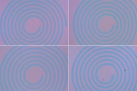 MIT researchers have developed a technique to grow 2-D materials directly onto patterned substrates (shown here) and then recycle the patterns for faster, simpler chip manufacturing.