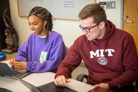 First-year students Ifeoluwapo Ademolu-Odeneye (left) and Keith Murray at work in the MIT Digital Humanities Lab.  