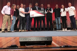 Acoustic wells chief operating officer Charles-Henri Clerget (sixth from left), chief executive officer Sebastien Mannai SM ’14 PhD ’18 (sixth from right), and chief technology officer Louis Creteur (fifth from right) pose with judges and organizers after winning Wednesday’s $100K Entrepreneurship Competition.
