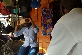 A survey team led by grad student Andrew Miller displays use of the virtual reality equipment, which helped elicit feedback on providing information about crimes in Lagos, Nigeria.