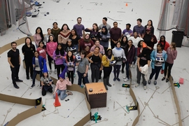 Middle school and high school girls meet in MIT's Building 31 to showcase the capabilities of the autonomous cars their teams programmed to navigate a circuitous course. 