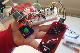 Jose Gomez-Marquez holding an open glucometer prototype at MIT Little Devices Lab  