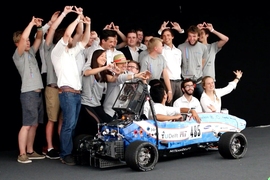 MIT Driverless and TU Delft pose with their race car, DUT18, at Formula Student Germany 2019. The joint team placed third overall.