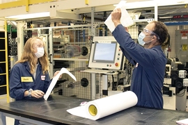 3M is collaborating with the lab of MIT Associate Professor Hadley Sikes to jointly develop a rapid Covid-19 test. Here, 3M Covid-19 test team members work in a pilot lab facility.