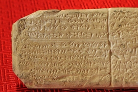 Photo of an ancient tablet showing the language of Ugaritic