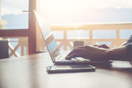 Stock photo of hands typing on a laptop