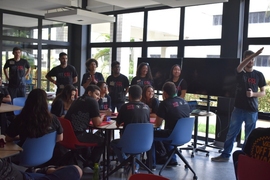 Photo of students in a classroom, all wearing “MIT GSL” T-shirts