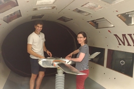 Photo of a student and professor in a wind tunnel