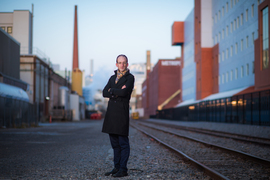 Photo of Michael Short outdoors against a blurred street scene