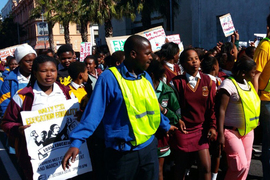 Individuals marching and protesting peacefully