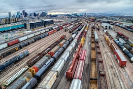 Photo of a busy rail yard with scores of tracks and dozens of trains