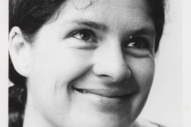 A black-and-white headshot of a smiling Mary Rowe