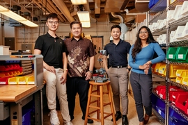 Rui Li, Russel Bradley, Tanach Rojrungsasithorn, and Aviva Jesse Levi pose with FrED, the manufacturing device they developed at MIT.