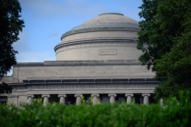 The Great Dome with trees and hedge in front.
