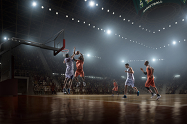 Professional basketball players playing a game of basketball
