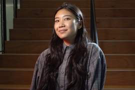 Ylana Lopez standing on a staircase