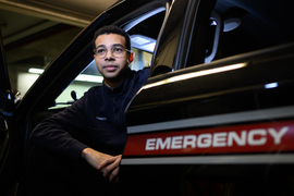 Josh Randolph sits in an emergency vehicle.