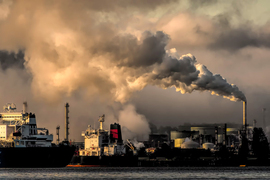 Industrial smoke stacks emitting smoke