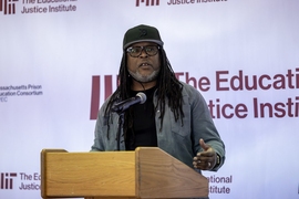 Shaka Senghor speaking at a lectern