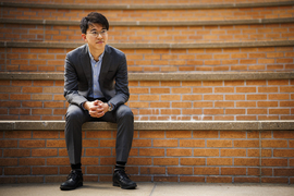 Naoki Egami sits on amphitheater stairs