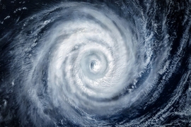 Swirling clouds of a well-defined cyclonic storm seen from space