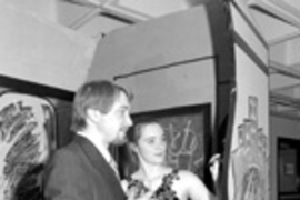Beth Haynes and Brian Butler (left) help decorate the interactive graffiti installation.