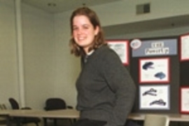 Mechanical engineering senior Aimee Angel of Portland, OR, who gradutes on Friday, June 2, demonstrates Power-Up, designed to assist people who have difficulty getting up from chairs.