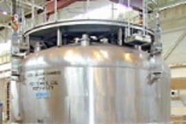 This 150-ton magnet in Japan is crucial to an international experiment  on nuclear fusion (a cover is held above it, ready to be put in place for a test  run)