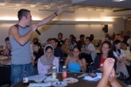 International students gathered to get to know each other and share how some of their expectations of the United States matched up with the reality they've experienced since arriving. Freshmen were gathered around tables with upperclassmen mentors interspersed, expressing their thoughts while one of the group took notes and got up to share with the entire group. Many laughs ensued, especially when...