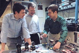 Postdoctoral associate Michel Godin, left, Associate Professor Scott
Manalis of biological engineering and postdoctoral associate Thomas Burg are part of an MIT team that has developed a technique to measure the mass of single cells.