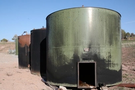 Tanks on retiree property after an explosion. Silt, Colorado. <a onclick="MM_openBrWindow('gastanks-1-enlarged.html','','width=509, height=583')">
<span onmouseover="this.className='cursorChange';">
<strong>Open image gallery</strong>
</span>
</a>
<noscript> <a href="gastanks-1-enlarged.html">
<em>(no JavaScript)</em>
</a>
</noscript>