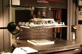 In the lab, a sample of the cellular composite material is prepared for testing of its strength properties. 