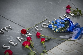 Situated on the site where Officer Sean Collier was killed on April 18, 2013, the Collier Memorial is composed of 32 blocks of granite that form a five-way stone vault. The smooth, curved vault contains the inscription: “In the line of duty, Sean Collier, April 18, 2013.”