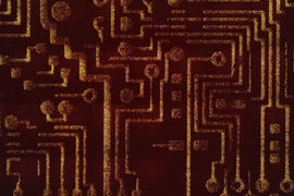 This image shows a motherboard image micropatterned using programmable probiotic bacteria. The bright lines are composed of dots made of bacteria. This technique was developed in the Bhatia laboratory. Researchers delivered artificial genetic circuits into the bacteria which allow the microbes to kill cancer cells in three different ways.
