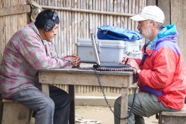 Brandeis University professor Ricardo Godoy conducts the experiment in a village in the Bolivian rainforest. The participants were asked to rate the pleasantness of various sounds, and Godoy recorded their response.
