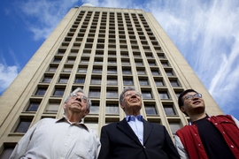 (Left to right): M. Nafi Toksöz, professor in the Department of Earth, Atmospheric and Planetary Sciences (EAPS); Oral Buyukozturk, professor in the Department of Civil and Environmental Engineering (CEE); and Hao Sun, a postdoc in CEE. The Green Building, behind them, has 36 accelerometers that record vibrations and movements on selected floors, from the building’s foundation to its roof.
