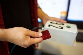 Hao Sun holds an example of a sensor. “I would envision that, in the future, such a monitoring system will be instrumented on all our buildings, city-wide,” says Sun. “Outfitted with sensors and central processing algorithms, those buildings will become intelligent, and will feel their own health in real time and possibly be resilient to extreme events.”
