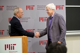 MIT President L. Rafael Reif (left) opened the MIT press conference and congratulated Holmström.
