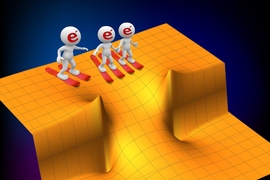 New research shows that electrons passing through a narrow constriction in a piece of metal can move much faster than expected, and that they move faster if there are more of them — a seemingly paradoxical result. In this illustration, the orange surface represents the potential energy needed to get an electron moving, and the “valley” at center represents the constricted portion.
