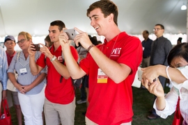 Orientation leaders welcomed freshmen and families, assisting with photos after the President’s Convocation.
