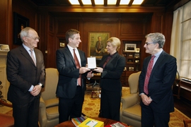 The president of Croatia, Kolinda Grabar-Kitarović, visited MIT on Monday, Dec. 4. From left: MIT physicist Marin Soljačić; MIT President L. Rafael Reif; Croatian president Kolinda Grabar-Kitarović; and the dean of the MIT School of Science, Michael Sipser. 
