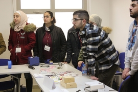 Students listen attentively as their year-long series of classes begins.
