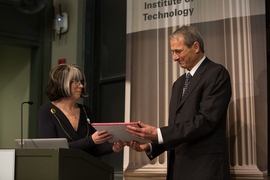 Richard Schrock receives the James R. Killian Jr. Faculty Achievement Award from Susan Silbey, the chair of MIT’s faculty.
