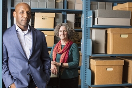 Craig Steven Wilder and Nora Murphy, photographed in the Institute Archives and Special Collections Reading Room in Building 14N. 
