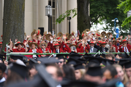 Rows of MIT alumni from class of '72, wearing signature red jackets.