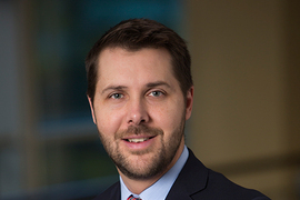 head-and-shoulders portrait photo of Brian Deese