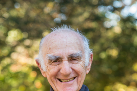 Portrait photo of Lee Grodzins, later in life, with trees in the background