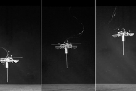 Three stages of an insect-size robot flying off the ground