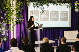 Anna Kazlauskas on stage at an AI Data Summit 
