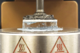 Hair gel squeezed down by machine.